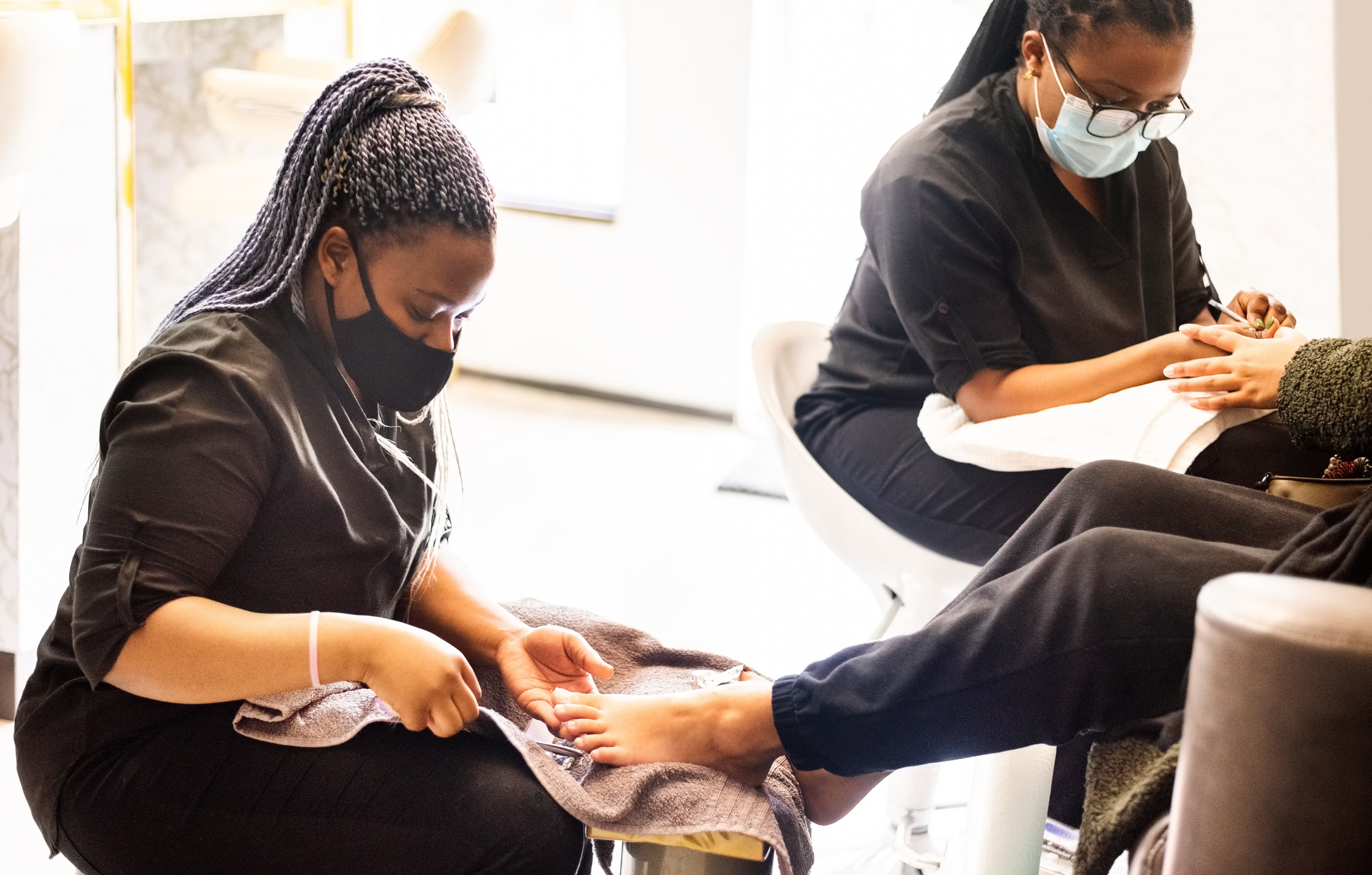 Woman having pedicure and manicure at beauty spa during pandemic Woman having pedicure and manicure at beauty spa during pandemic